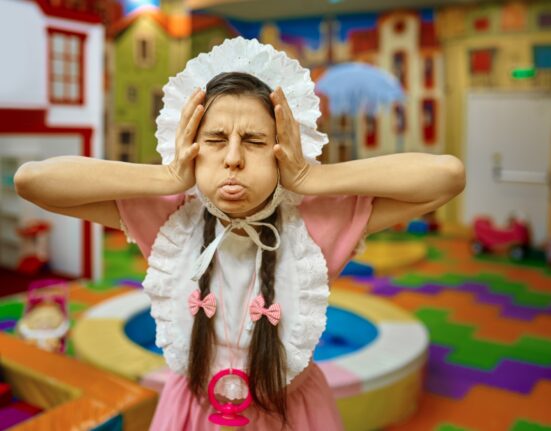 portrait funny woman like newborn baby grimacing